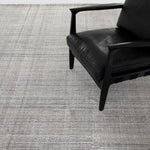 Amaud 6 x 9' Rug Grey Staged View with Accent Chair ILMT-002-0609