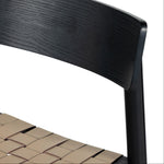 Heisler counter stool right side close up woven leather seating and black back rest