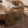 Four Hands Abaso Round Coffee Table staged side view 