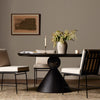 Bibianna Round Dining Table Worn Black Marble Staged View Four Hands