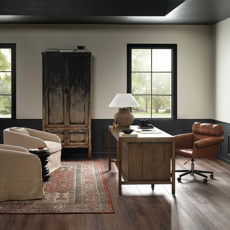 Four Hands Suspension Desk paired with Arnold leather desk chair  in a beautiful home office setting.