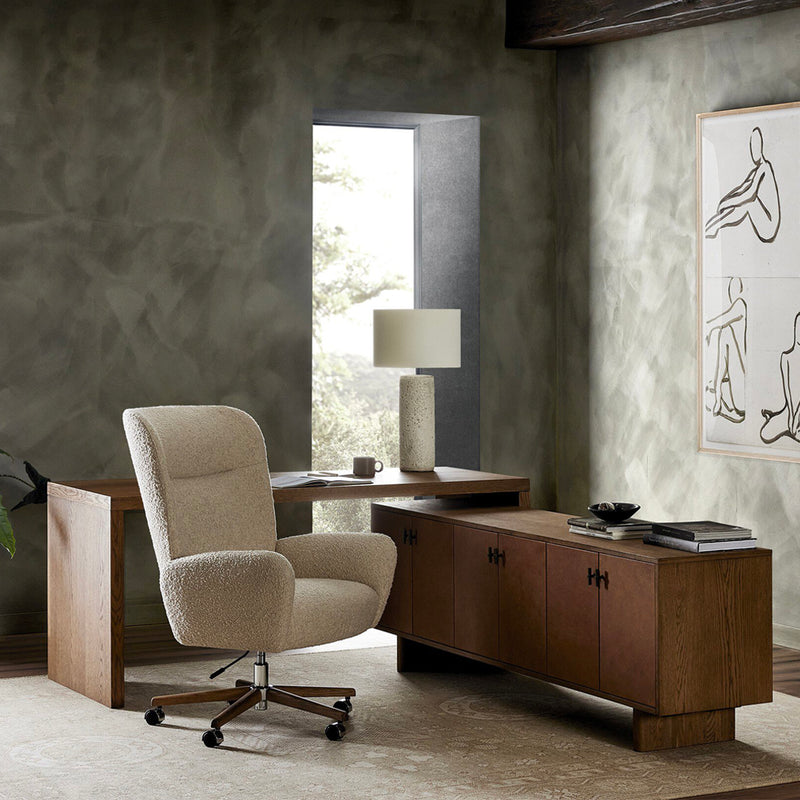 A modern office setting featuring the Posada L Shape Desk paired with the Cade Desk Chair