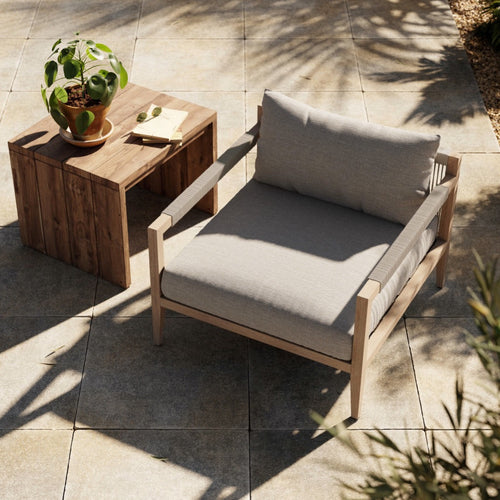 Sherwood Outdoor Chair, Washed Brown Staged View in Outdoor Setting