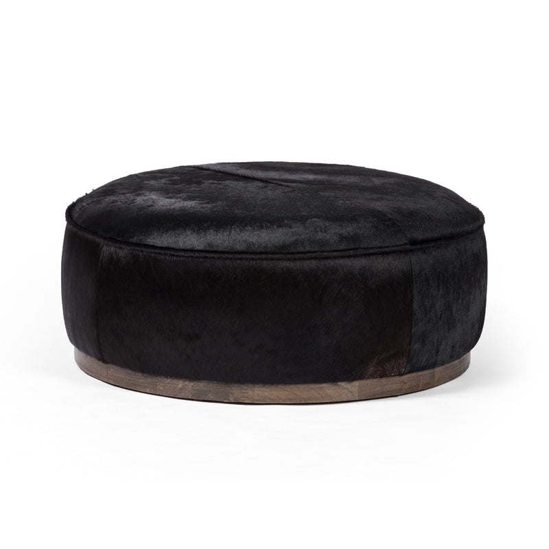 Sinclair Large Round Ottoman Black Hair on Hide Angled View 106119-014
