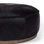 Four Hands Sinclair Large Round Ottoman Black Hair on Hide Covering Detail