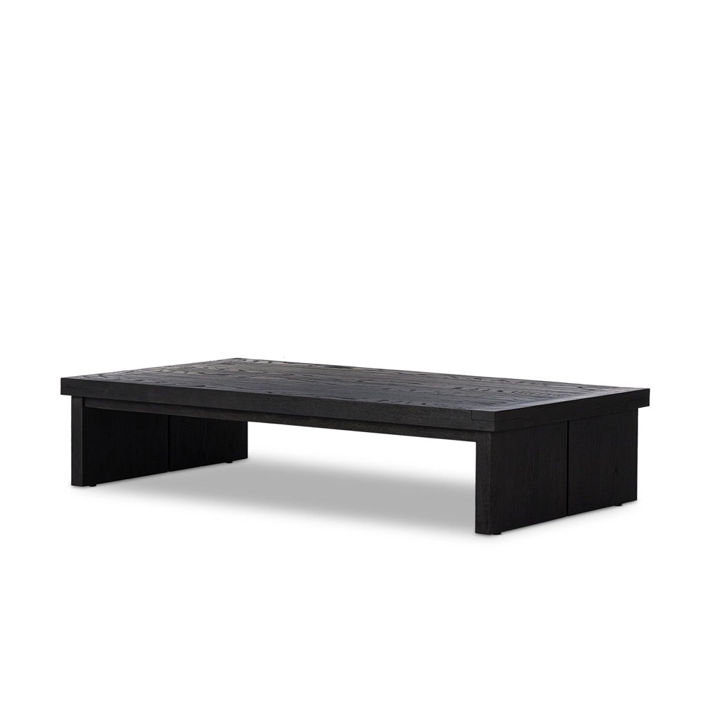Warby Coffee Table Worn Black Veneer Angled View Four Hands