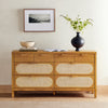 Allegra 8 Drawer Dresser-Natural Cane front view shown with wall art, vases and books 