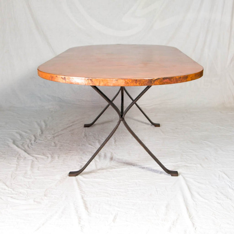 iron table base with hammered copper top