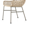 Four Hands Bandera Outdoor Woven Dining Chair right side view of wicker and bronze iron base