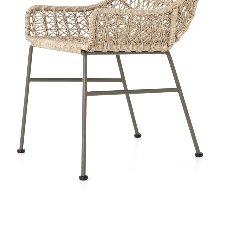 Four Hands Bandera Outdoor Woven Dining Chair right side view of wicker and bronze iron base