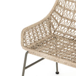 Bandera Outdoor Woven Dining Chair up close left side view of wicker back rest and seat