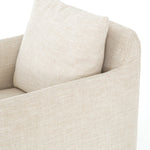 white upholstered swivel chair