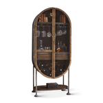 Bowery Tall Oval Bar Cabinet with prop wine glasses and bottles stored inside.