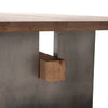Brennan Dining Table close up showing table top edge with steel leg and intersecting beam