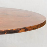 Edge view of Hammered Copper Dining Tabletop in Natural with spots finish