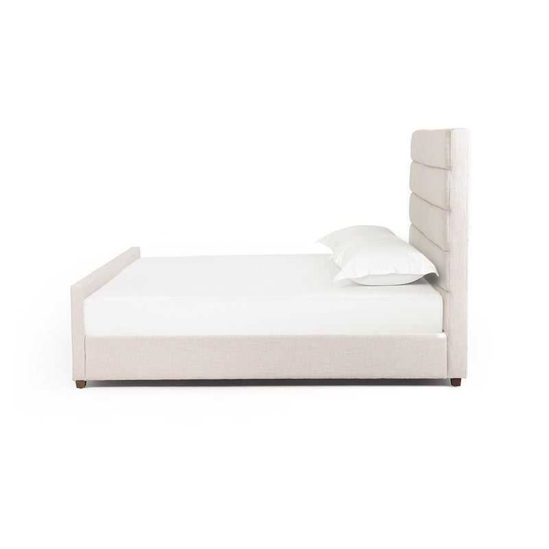 white upholstered bed