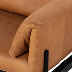 Jenkins Sofa close up of right arm top grain leather including the matte iron base