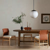 Lulu Armless Dining Chair featured with a wooden table