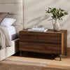 Four Hands Marion Nightstand shown next to a bed