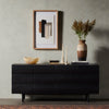 Pompey Media Console Black Ash Staged View with Decor Pieces Four Hands