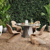 Portia Outdoor Dining Chair view of 4 chairs and a table in outdoor setting