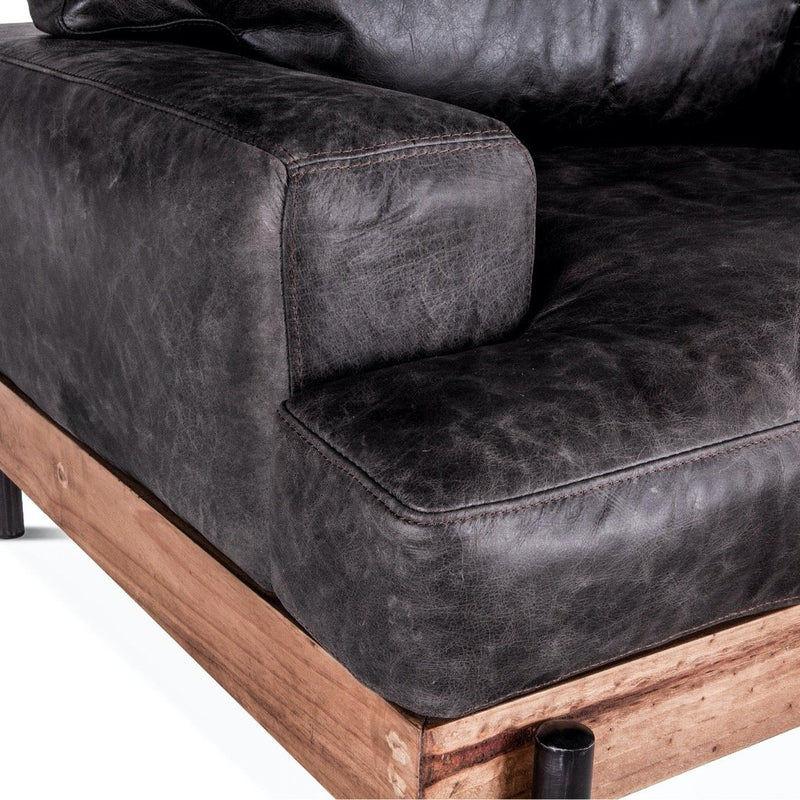 Home Trends and Design Portofino Leather Armchair Morocco Black up close view of left arm and seat