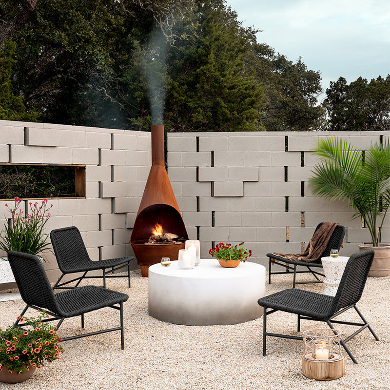 Sheridan Coffee Table Slate Grey Ombre Staged Image in Outdoor Setting with Firepit Four Hands
